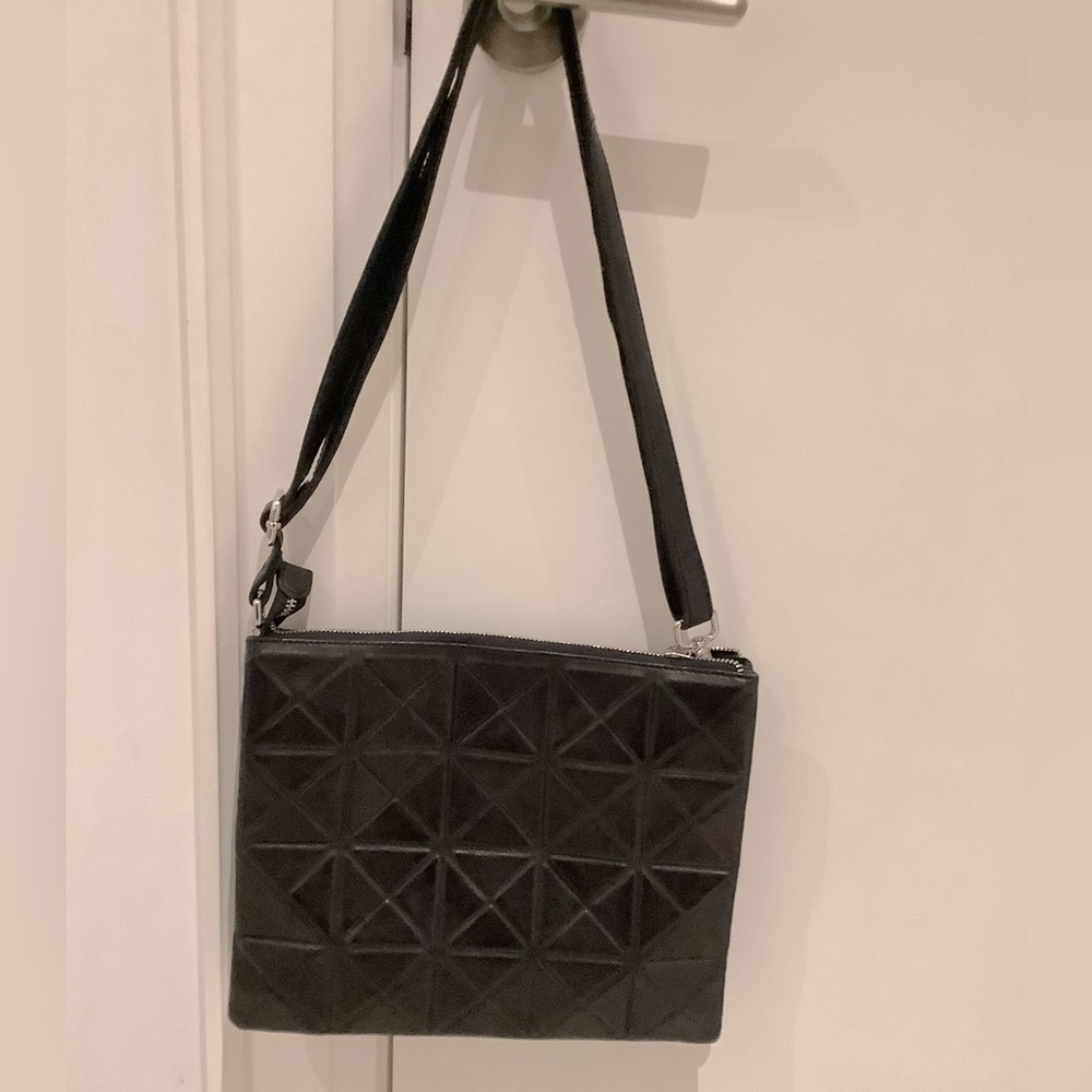 Black pure leather shoulder bag by Danier.
